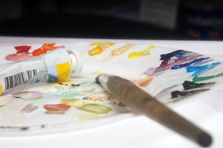 paintbrush, tubes of paint and porcelain plait as a paletteの写真素材