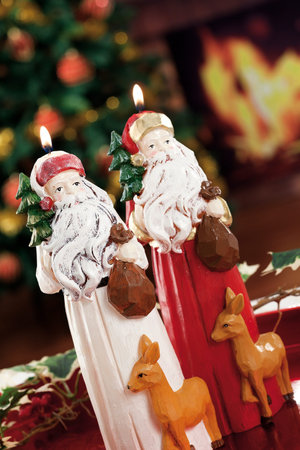 Christmas candles, baubles on background defocused lightsの写真素材