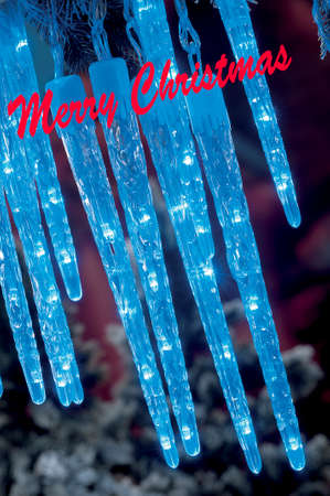 Christmas candles,baubles on background defocused lightsの写真素材