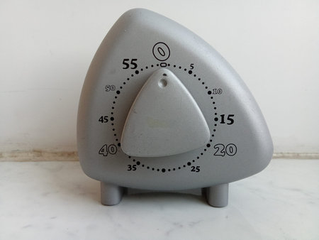 Metal timer for kitchen isolated on white.