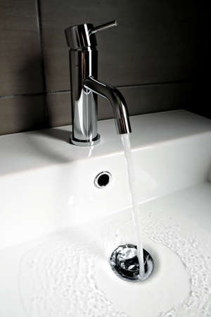 sink with open faucetの写真素材
