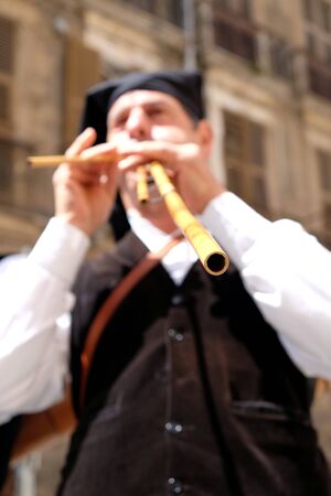 Cagliari/Italy - may 1, 2016: 360Â° Sant'Efisio folk and religious procession, launeddas musician intentionally  focused at the end of the caneのeditorial素材