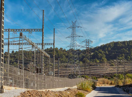 Power line, high voltage power line pylon. Cloudy sky background. Electric power concept.の写真素材