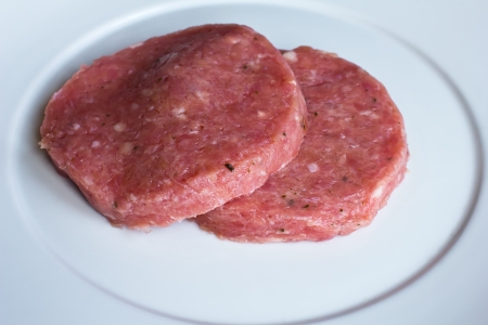 raw hamburger on the plateの写真素材
