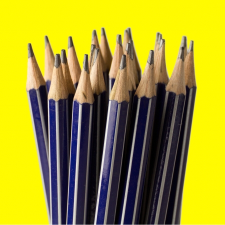 Stack of sharpened pencils, shallow focus on front center pencil.の写真素材