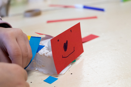 Construction of children's robots. Colored boxes with paper strips, inventions and creativity for children. Trash Robots, Tinkering and Making, Educational Activities for Schools and Childrenの写真素材