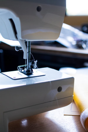 Detail of a white sewing machine. Need of a sewing machine