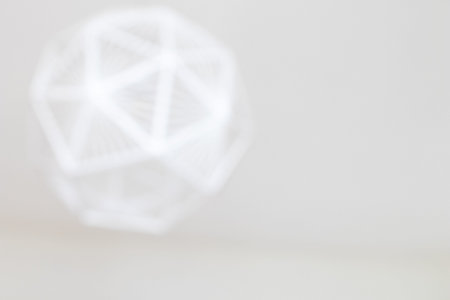 Blurred white background with heavy lights. Modern and abstract background blurred with rounded...