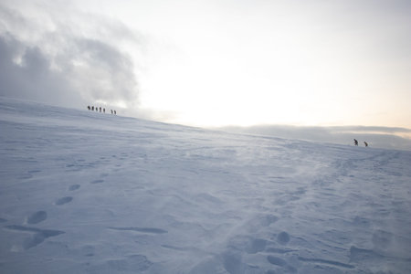 Polar landscape with snow and wind in the mountains. Hiking and snow hiking in the mountains with...