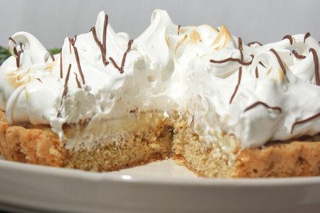 Cookie cake with cream and meringue