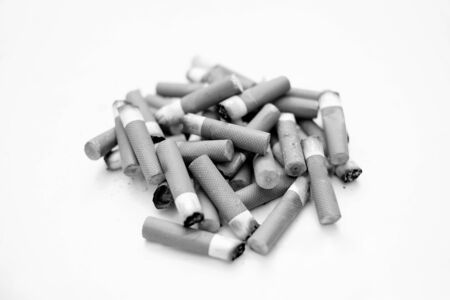 Cigarette butts isolated, stop smoke addiction concept, unhealthy pollution, bwの写真素材