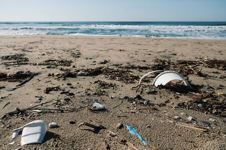 Plastic containers pollution on sea coast over blur background,planet saveの写真素材