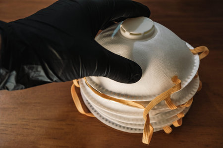 Man hand with plastic glove take a protective virus ffp2 mask,coronavirus covid