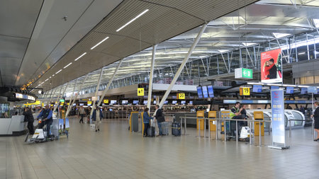 Schiphol airport departure hall,people tourists and workers,indoors amsterdamのeditorial素材