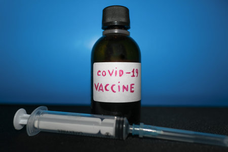 Covid19 testing vaccine container and empty syringe,coronavirus pandemic disease treatment
