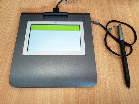 Electronic signature digitizer device on a desk,technology work tools