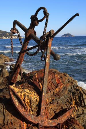 Alassio (SV), Italy - February 15, 2017: An old anchor at Alassio beach, Riviera dei Fiori, Savona, Liguria, Italy.のeditorial素材