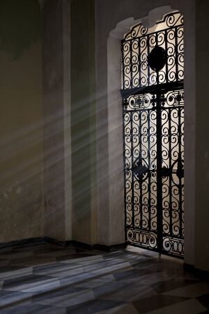 Laigueglia (SV), Italy - February 15, 2017: A door with a grate in Laigueglia church, Riviera dei Fiori, Savona, Liguria, Italy.のeditorial素材