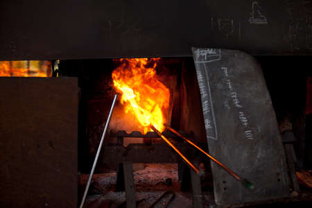 Algaida Es Pla, Majorca / Spain - August 25, 2016: The furnace at handmade glass manufacturing factory Guardiola, Algaida Es Pla, Mallorca, Balearic Islands, Spain.のeditorial素材