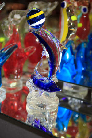 Algaida Es Pla, Majorca / Spain - August 25, 2016: A colorful dolphin created at handmade glass manufacturing factory Guardiola, Algaida Es Pla, Mallorca, Balearic Islands, Spain.のeditorial素材