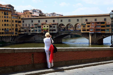Firenze, Italy - April 21, 2017: Tourist taking a picture of the Ponte Vecchio, Florence, Firenze, Tuscany, Italyのeditorial素材