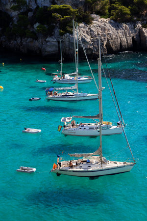 Macarella, Menorca / Spain - June 25, 2016: Boats at Cala Macarella bay, Menorca, Balearic Islands,...
