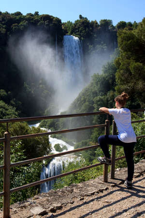 Terni (TR), Italy - May 10, 2016: A girl looks the famous Marmore waterfall, Terni, Umbria, Italyのeditorial素材