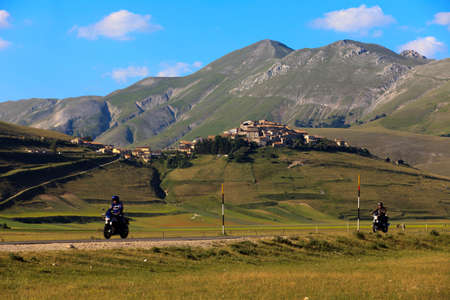 Norcia (PG), Italy - May 25, 2015: Motorcyclists on the road to Castelluccio di Norcia, Highland of Castelluccio di Norcia, Norcia, Umbria, Italy, Europeのeditorial素材