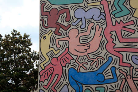 Pisa (PI), Italy - June 10, 2017: The Pisa's Mural (1989) Keith Haring - painted on the south wall of the Church of St Anthony, Pisa, Tuscany, Italy, Europeのeditorial素材