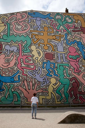 Pisa (PI), Italy - June 10, 2017: The Pisa's Mural (1989) Keith Haring - painted on the south wall of the Church of St Anthony, Pisa, Tuscany, Italy, Europeのeditorial素材