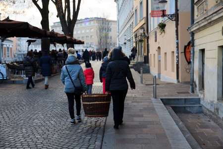 Lubiana / Slovenia - December 8, 2017: Tourist carry a basket in Lubiana town, Sloveniaのeditorial素材