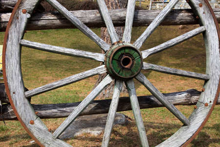 Cravegna (VCO), Italy - December 19, 2017: An old cart wooden wheel near a fence, Vigezzo Valley, VCO, Piedmon, Italyのeditorial素材