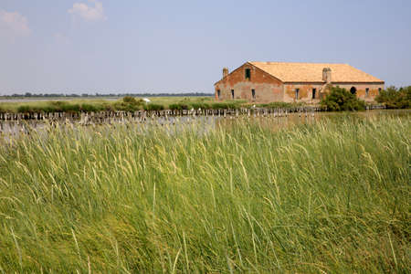 Po river (FE),  Italy - April 30, 2017: An old Fisherman's house on Po river, Delta Regional Park, Emilia Romagna, Italyのeditorial素材