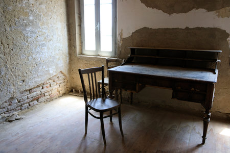 Po river (FE),  Italy - April 30, 2017: A old chair and table in a fisherman's houses inside on Po...