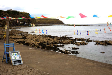 Pennan village (Scotland), UK - August 01, 2018: Beach at Pennan village, Fraserburgh, Scotland, Highlands, United Kingdomのeditorial素材