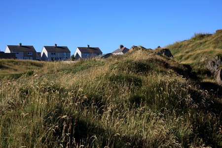 Portknockie (Scotland), UK - August 01, 2018: Coastal landscape at Bow Fiddle Rock sea arch, Portknockie, Scotland, Highlands, United Kingdomのeditorial素材