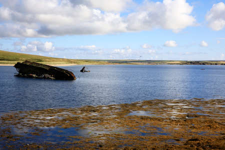 Scapa Flow - Orkney (Scotland), UK - August 08, 2018: World War II boat intentionally sunk to protect the natural harbour of Scapa Flow, Orkney, Scotland, Highlands, United Kingdomのeditorial素材