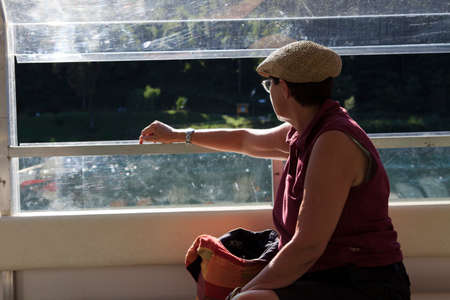 Sesto Calende (VA), Italy - September 15, 2016: A tourist look the landscape from a  boat on Ticino River, Lombardy, Piedmont, Italy.のeditorial素材