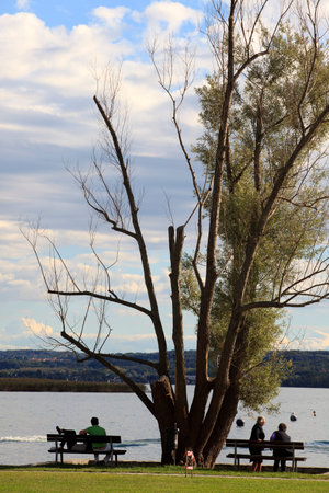 Angera (VA), Italy - September 15, 2016:  Tourist relaxing at Angera Lake, Angera, Maggiore Lake, Varese, Lombardy, Italy.のeditorial素材