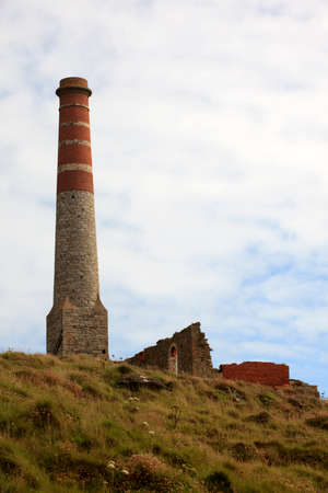 Botallack (England), UK - August 16, 2015: Chimney stack ruined mineshaft Botallack tin mine, Cornwall, England, United Kingdom.のeditorial素材