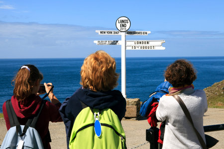 Land's End area (England), UK - August 16, 2015: Tourist look a sign in The Land's End area, Cornwall, England, United Kingdom.のeditorial素材