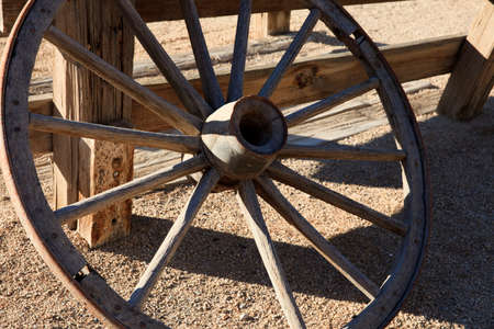 California / USA - August 22, 2015: A wooden wagon wheel in Death Valley National Park, California, USAのeditorial素材