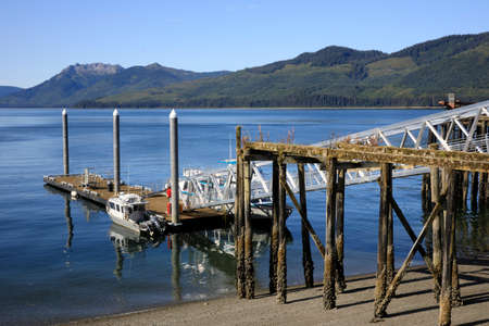 Strait Point, Alaska / USA - August 13, 2019: A wooden pier at Strait Point, Strait Point, Alaska, USAのeditorial素材
