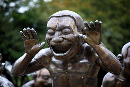 Vancouver, America - August 18, 2019: Giant Laughing Statues to stay in English Bay, Vancouver, Americaのeditorial素材