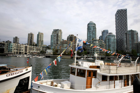Vancouver, America - August 18, 2019: Boats at False Creek Bay alongside the Granville street...