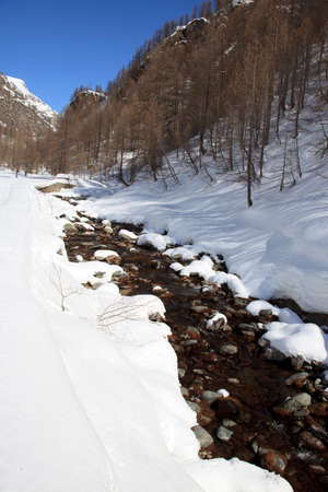 Devero Park ( Verbano-Cusio-Ossola ), Italy - January 15, 2017: A river near Crampiolo village in Alpe Devero Park, Ossola Valley, VCO, Piedmont, Italyのeditorial素材
