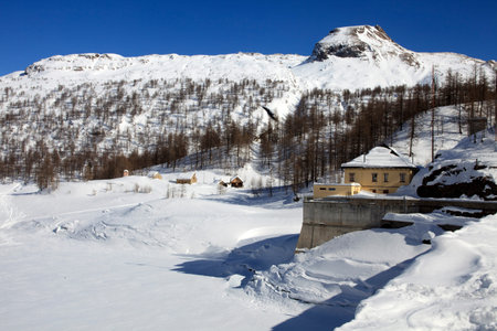Devero Park ( Verbano-Cusio-Ossola ), Italy - January 15, 2017: The Codelago dam in Alpe Devero...