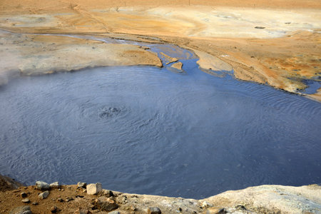 Hverir / Iceland - August 30, 2017: Hot water at Hverir geothermal area near Namafjall mountain,...