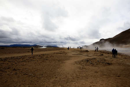Hverir / Iceland - August 30, 2017: Tourists walking at Hverir geothermal and sulfur area near Namafjall mountain, Myvatn Lake area, Iceland, Europeのeditorial素材