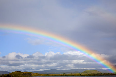 Myvatn / Iceland - August 30, 2017: A spectacular rainbow at lake Myvatn, Iceland, Europe